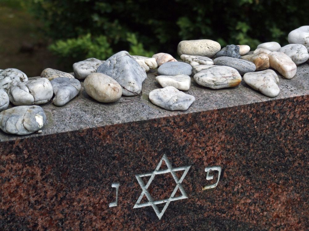 Headstone with Star of David and stones, on a Jewish grave.