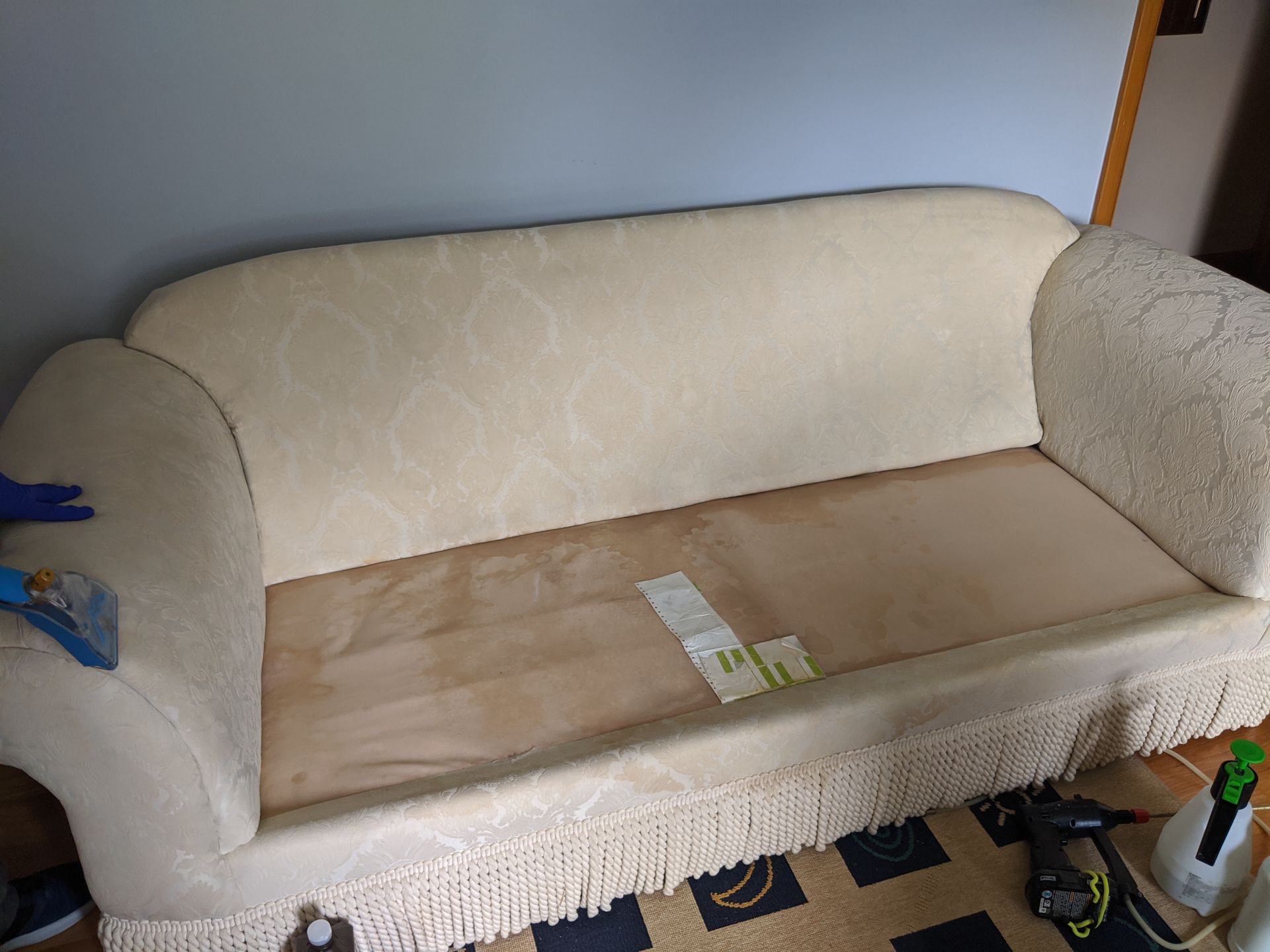 couch being cleaned
