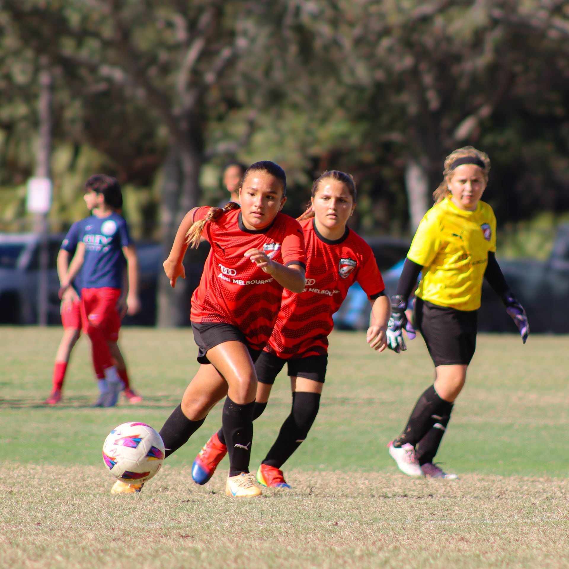 Girls playing soccer for Space Coast United Soccer