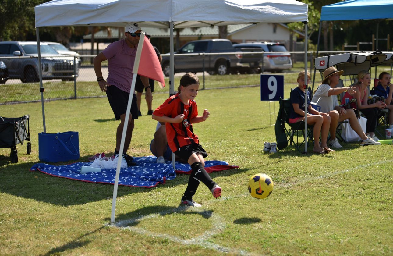 Kids playing soccer for Space Coast United Soccer
