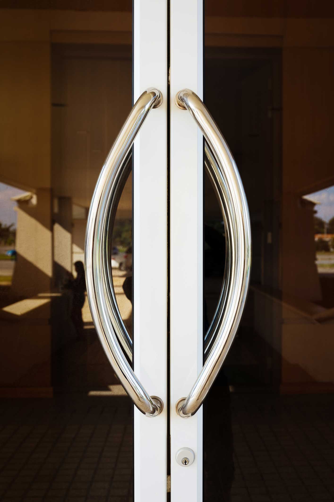 A close up of a door with two handles on it