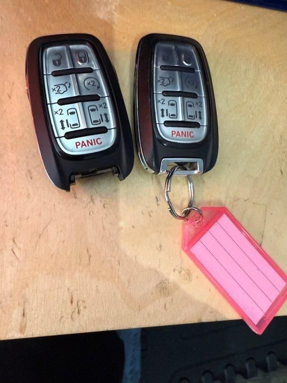 Two remote controls with panic written on them