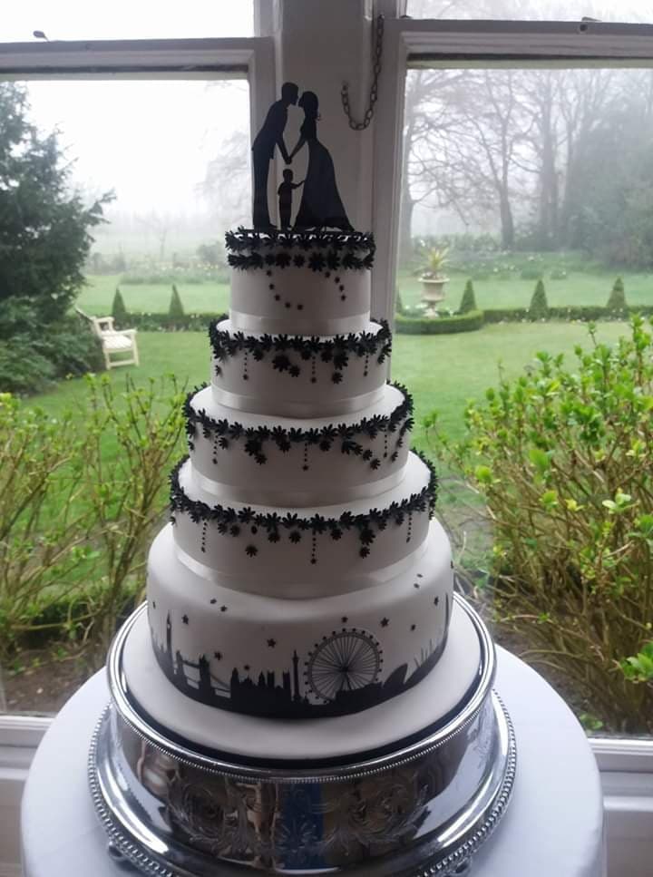 black and white wedding cake London skyline