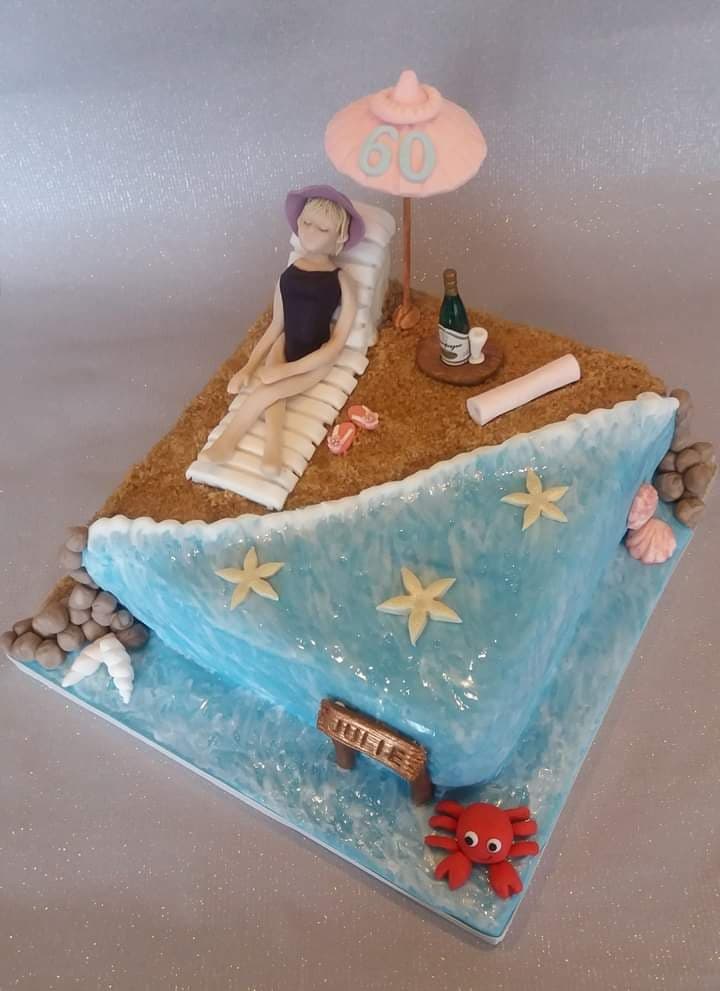 beach cake with woman sunbathing