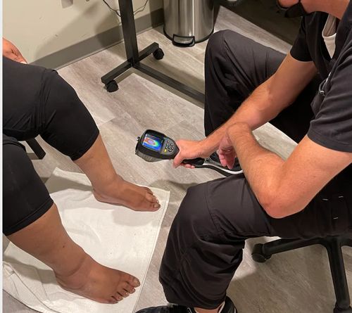 patient receiving neuropathy nerve exam from doctor