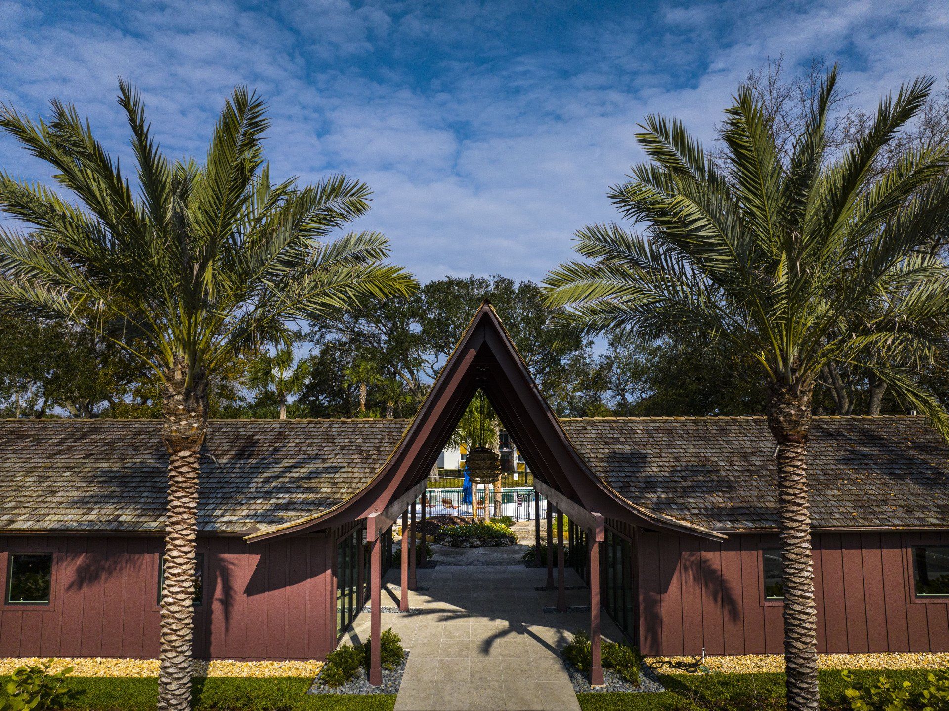 Hale Nani apartment community pavilion with palm trees.