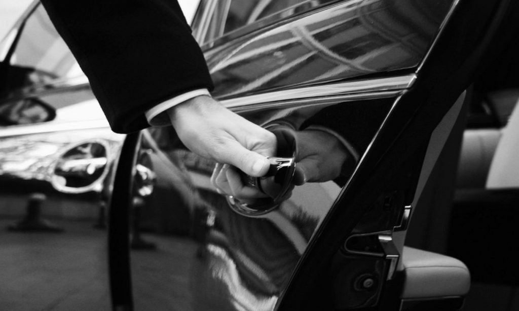 Picture of a driver at LS Autody opening the door for a client