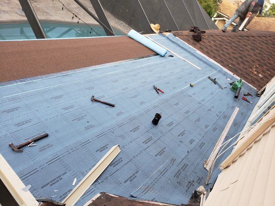 Roof Maintenance — A Roof Leak Repair Being Done in Jacksonville, FL