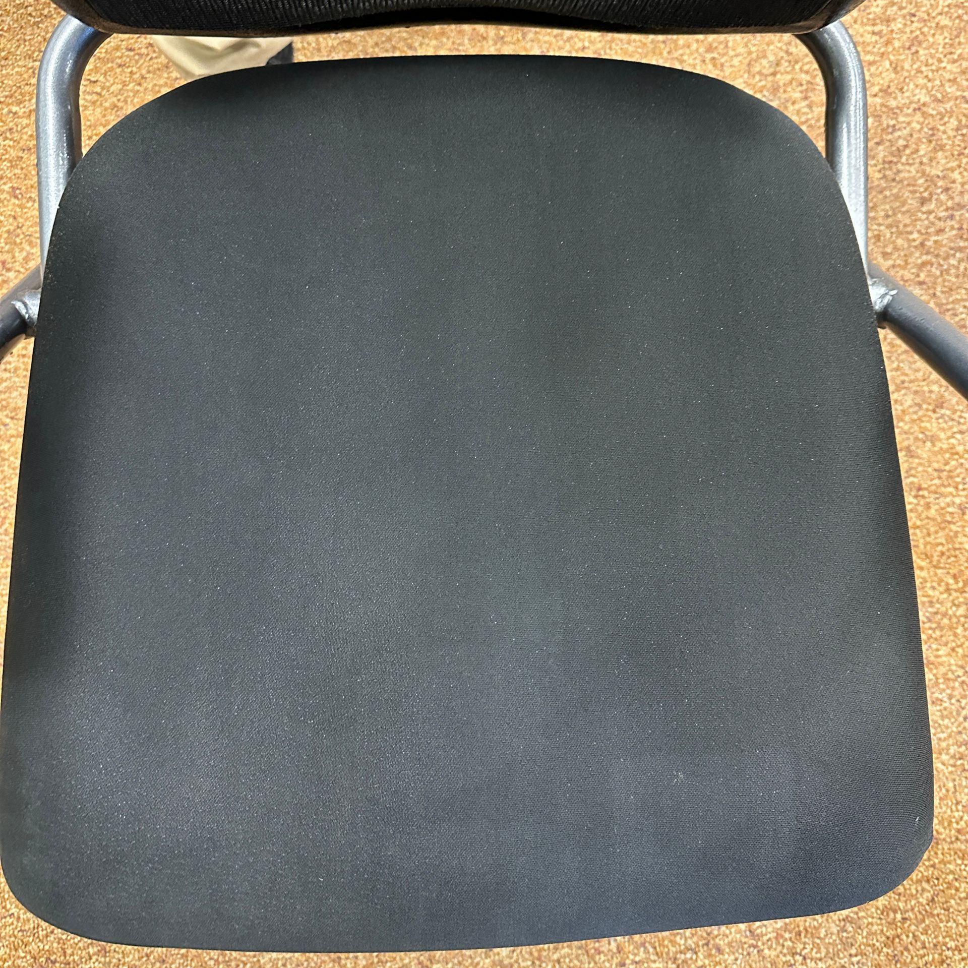 Black mesh office chair seat and back.