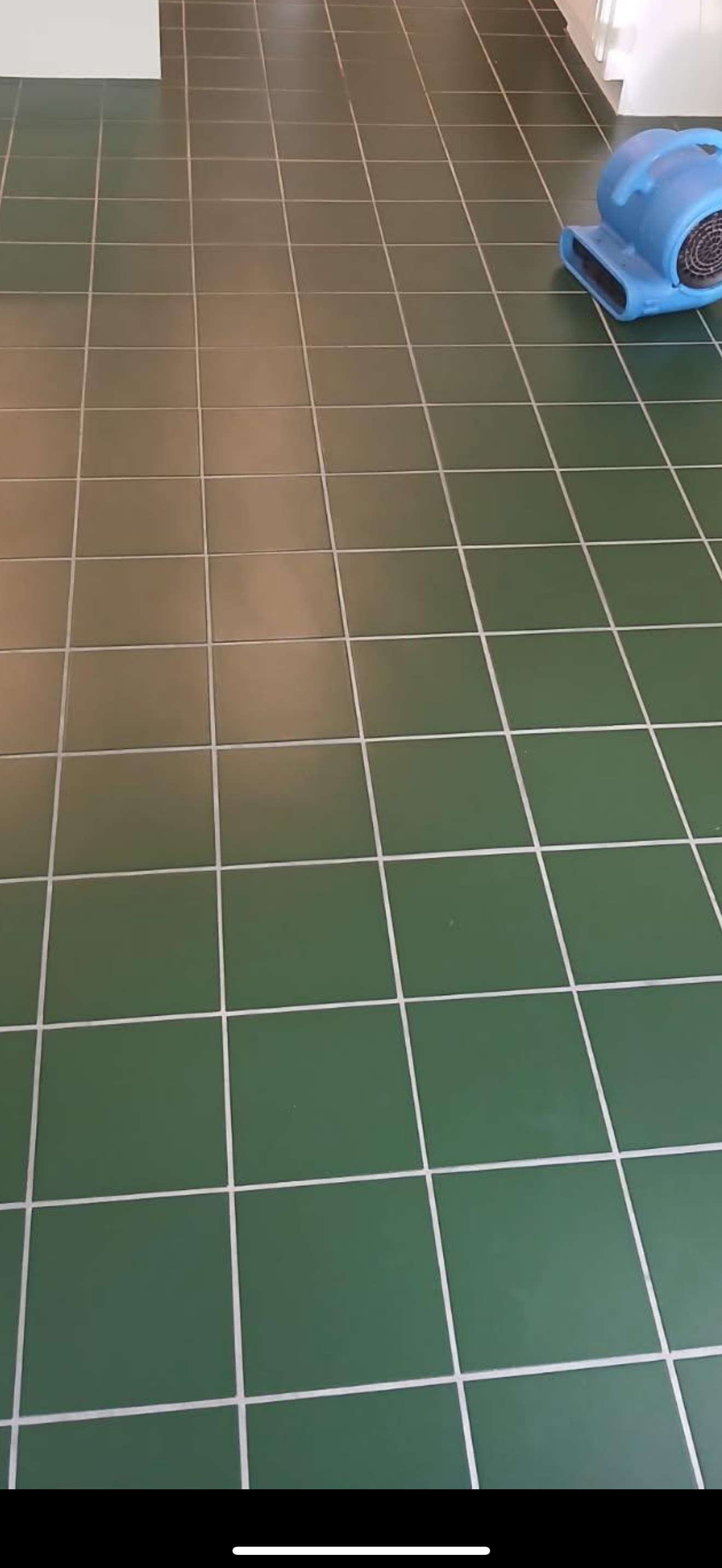 A living room with a couch , chair , and television.