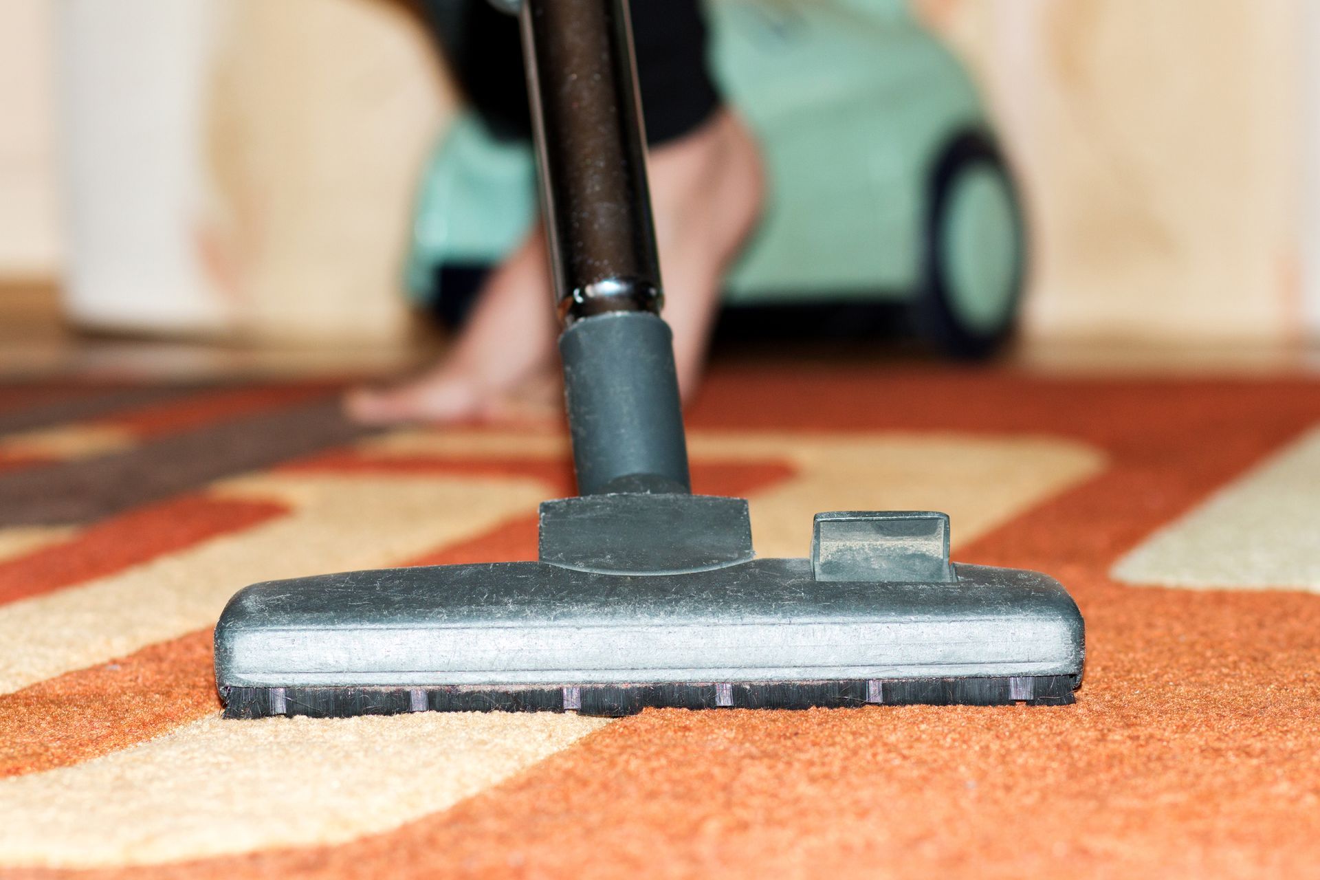 Vacuum cleaner on a carpet.