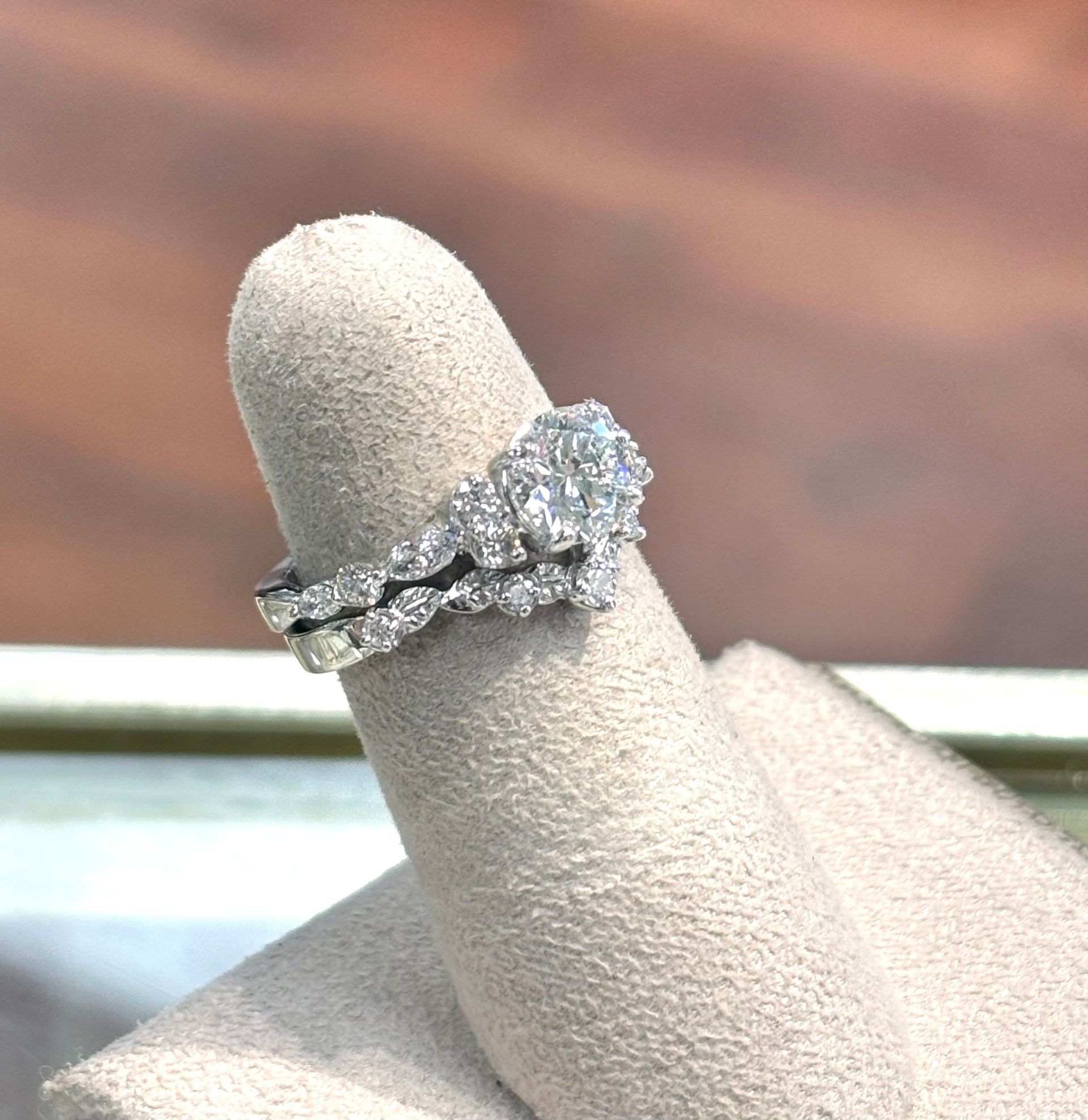 A wedding ring and engagement ring on a finger