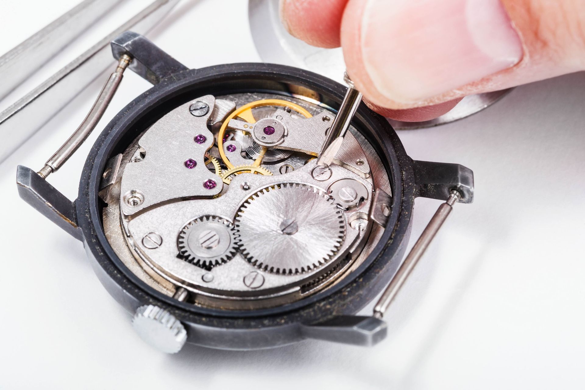 watchmaker repairing an old watch