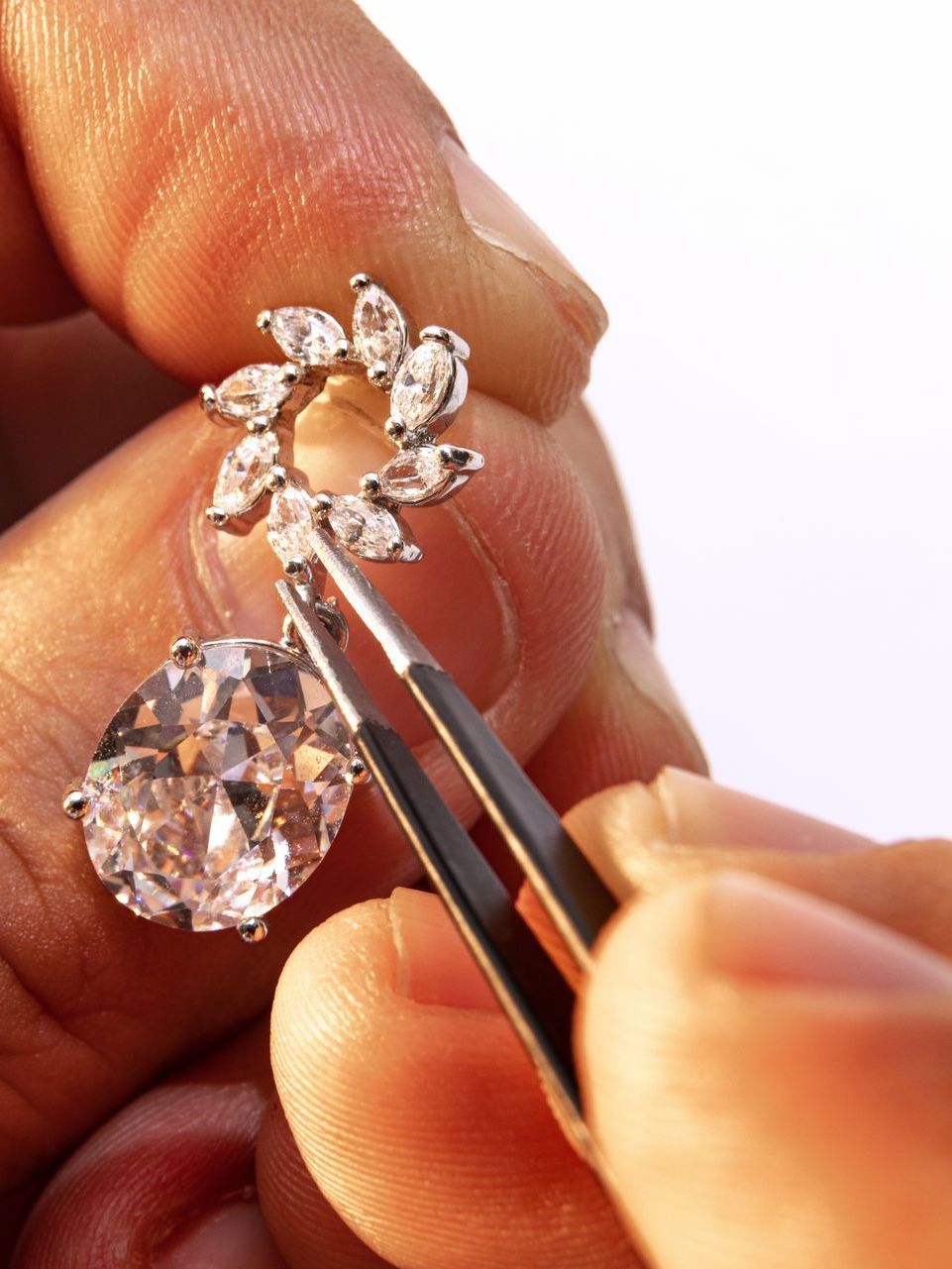repairman repairing diamond earring