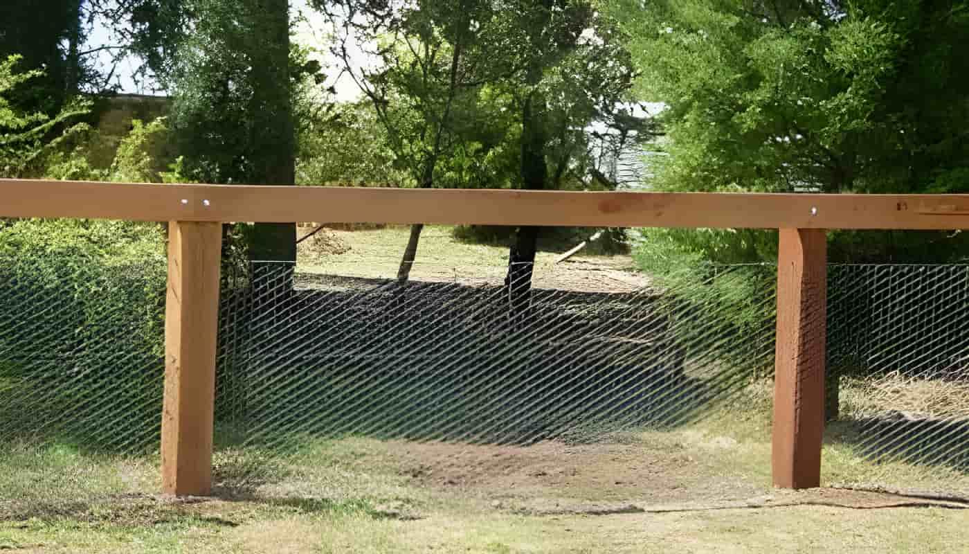 A Wooden Fence With a Chain Link Fence — Osborne Fencing in Bundanoon, NSW