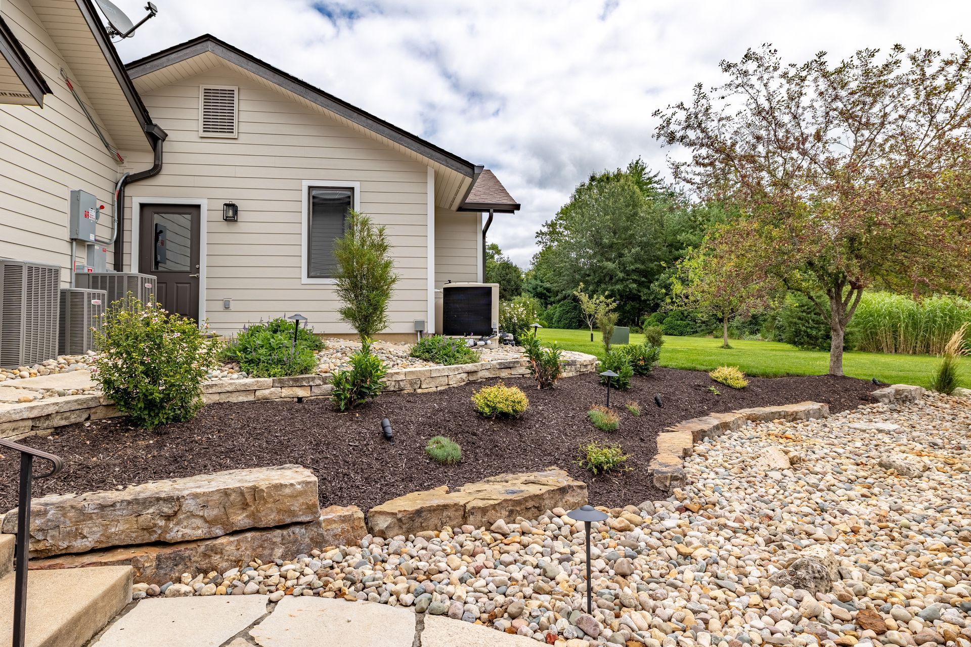 A house with a lot of rocks in front of it.