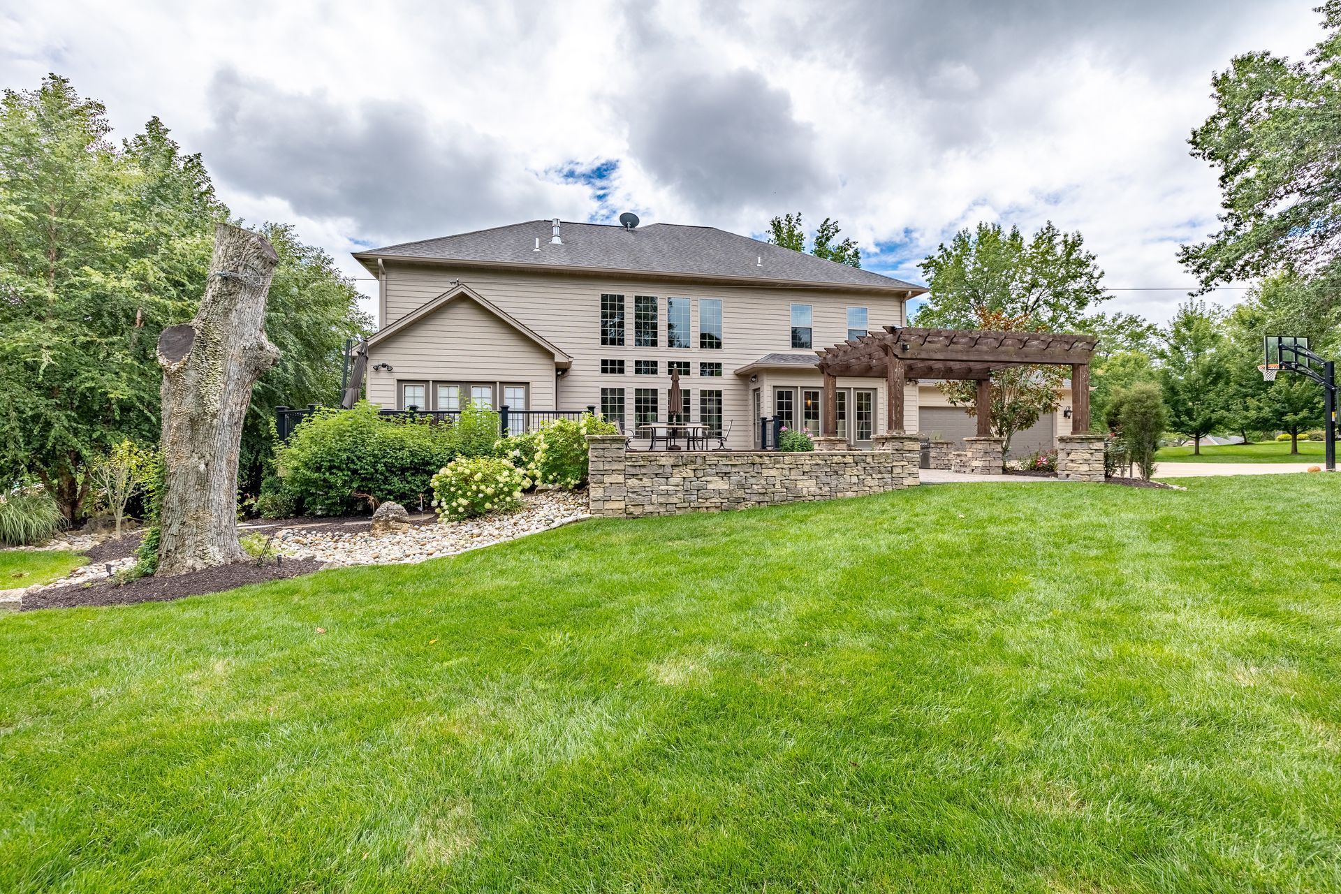 A large house with a large lawn in front of it.
