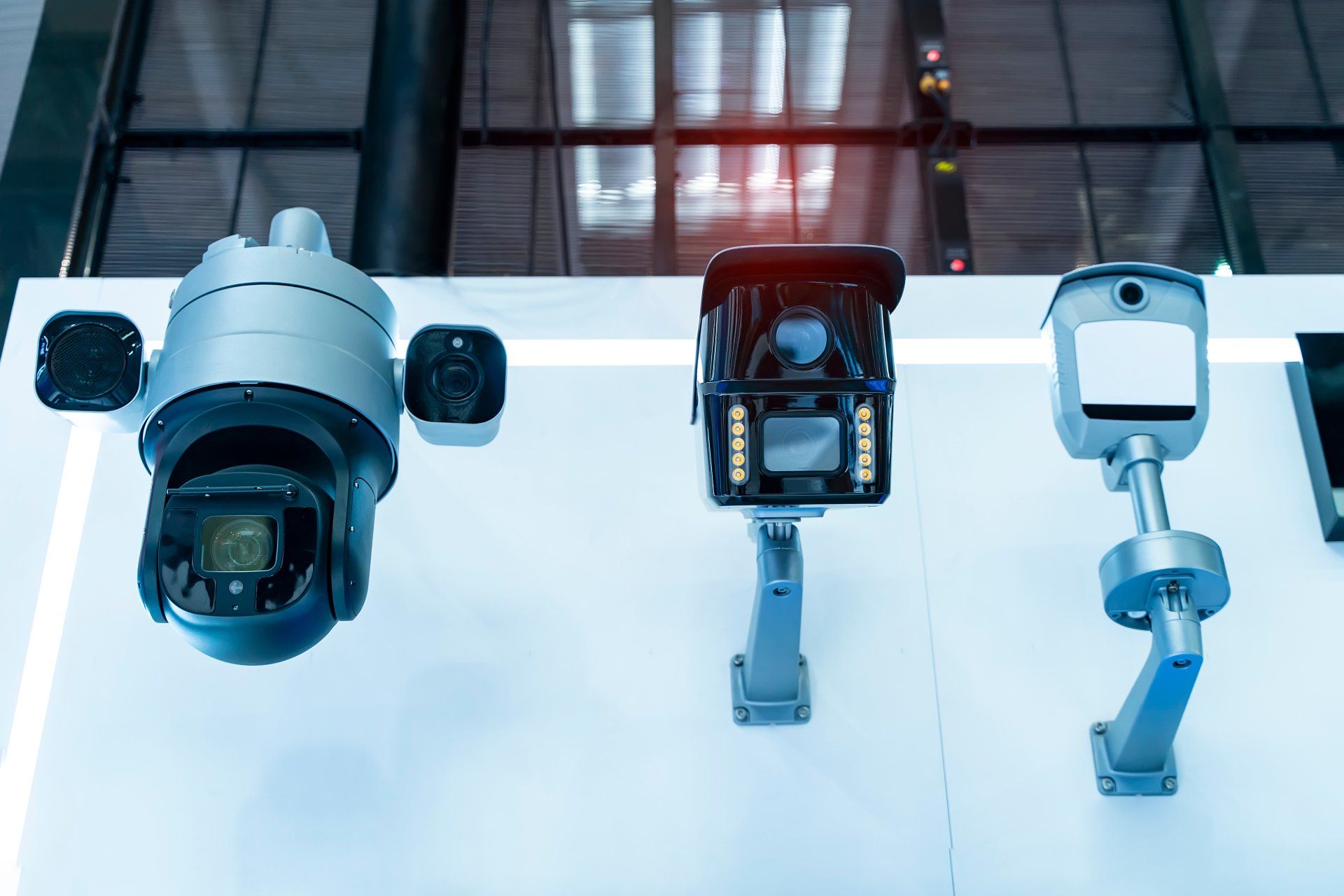 A row of security cameras sitting on top of a table.