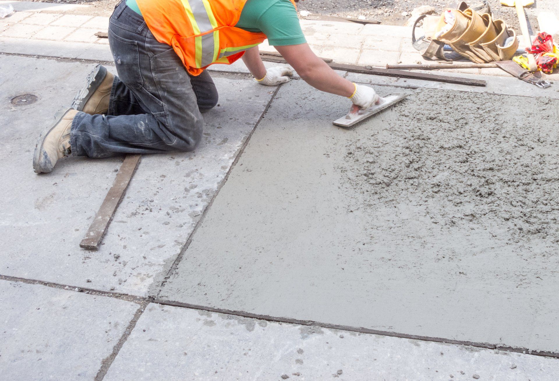 Naples Concrete Solutions' contractor patching cracks in a Marco Island, FL driveway