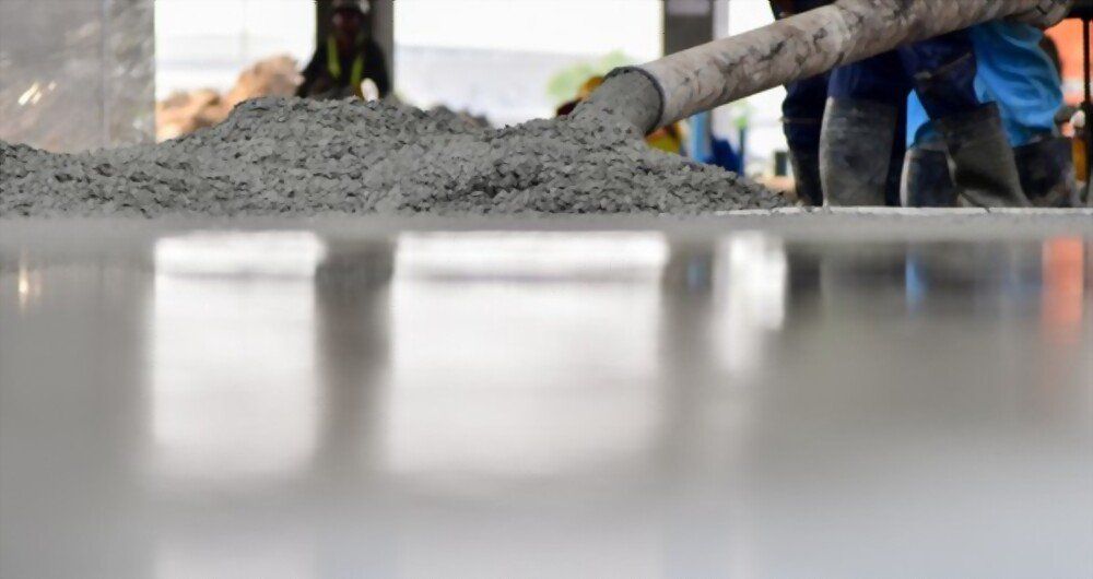 a specialized machine is used to pour concrete mixture to create flooring