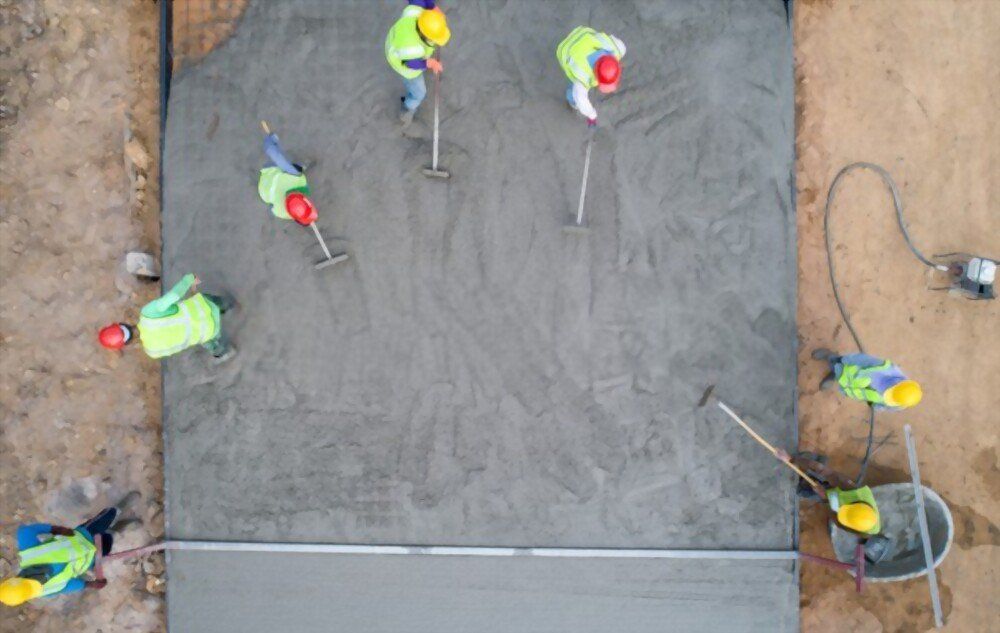aerial view of contractors performing driveway resurfacing in Naples Manor FL