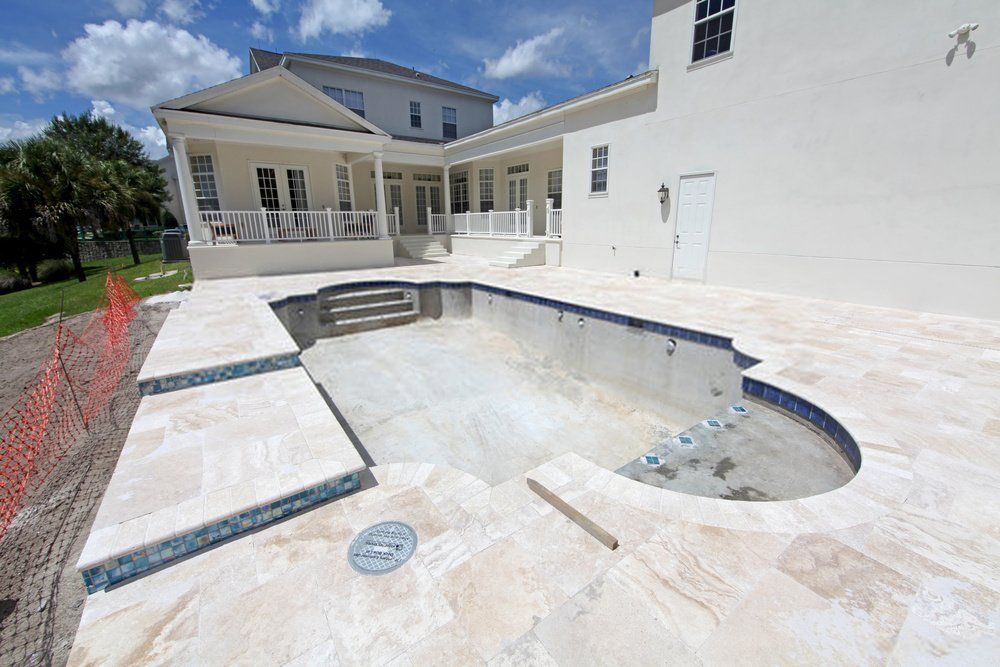 beautiful and durable stamped concrete pool deck in a residential property in Lely FL