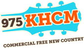 975 KHCM radio logo in orange and brown on a turquoise guitar pick, with “Commercial Free New Country” text