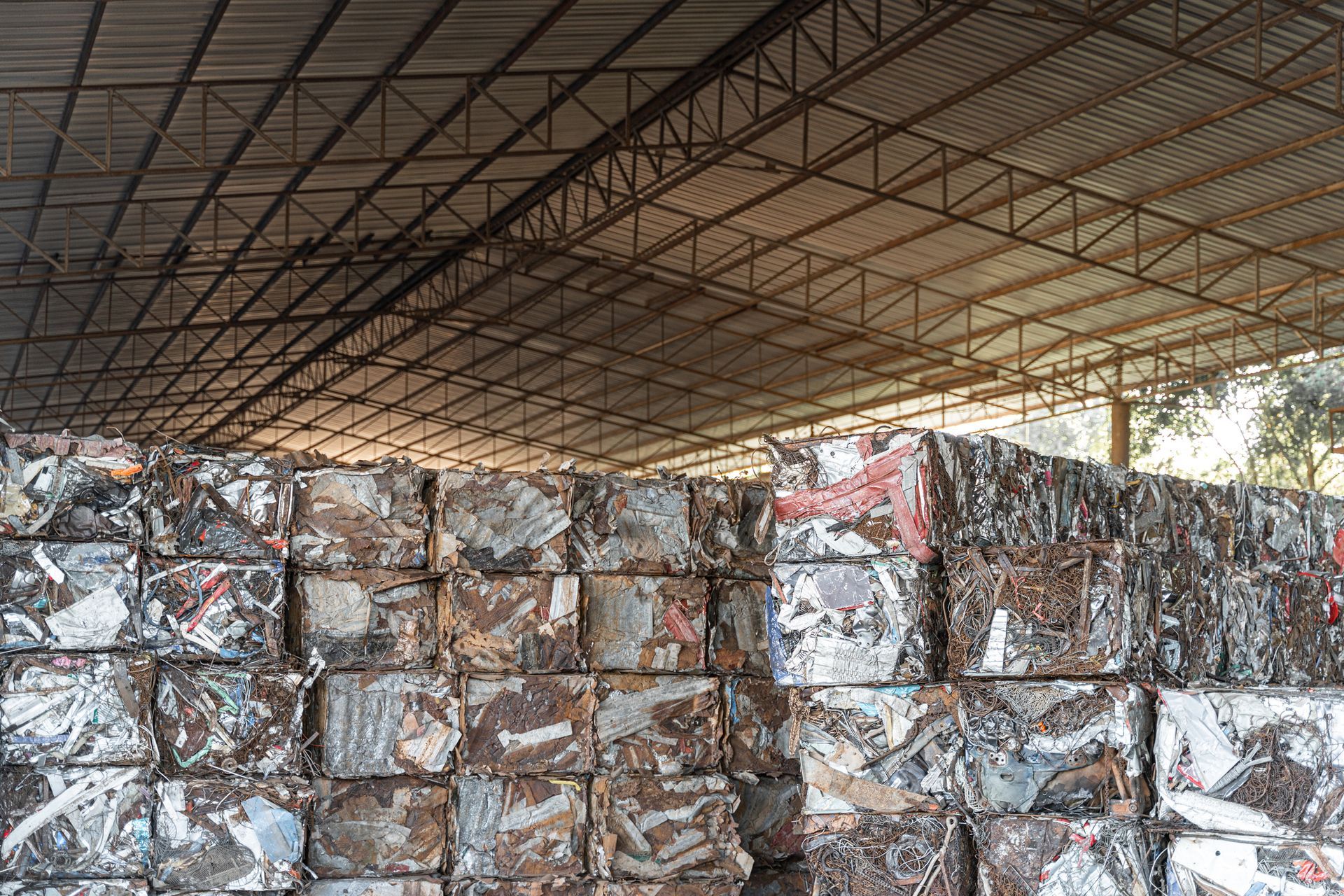 A compressed recycle steel stack at a waste plant.