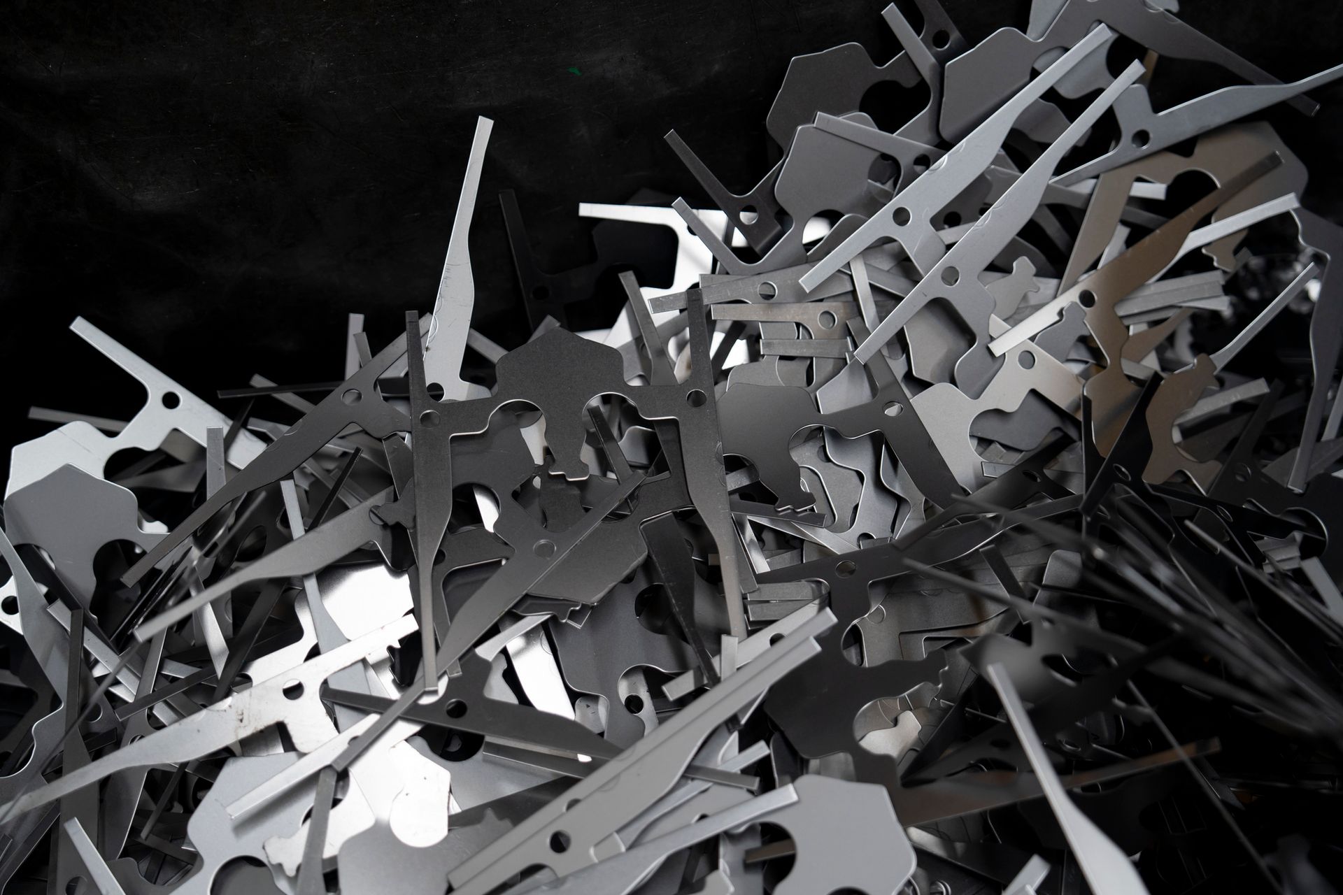 Close up photo of silver color scrap metal and metal trash Close up photo of silver color scrap metal and metal trash
