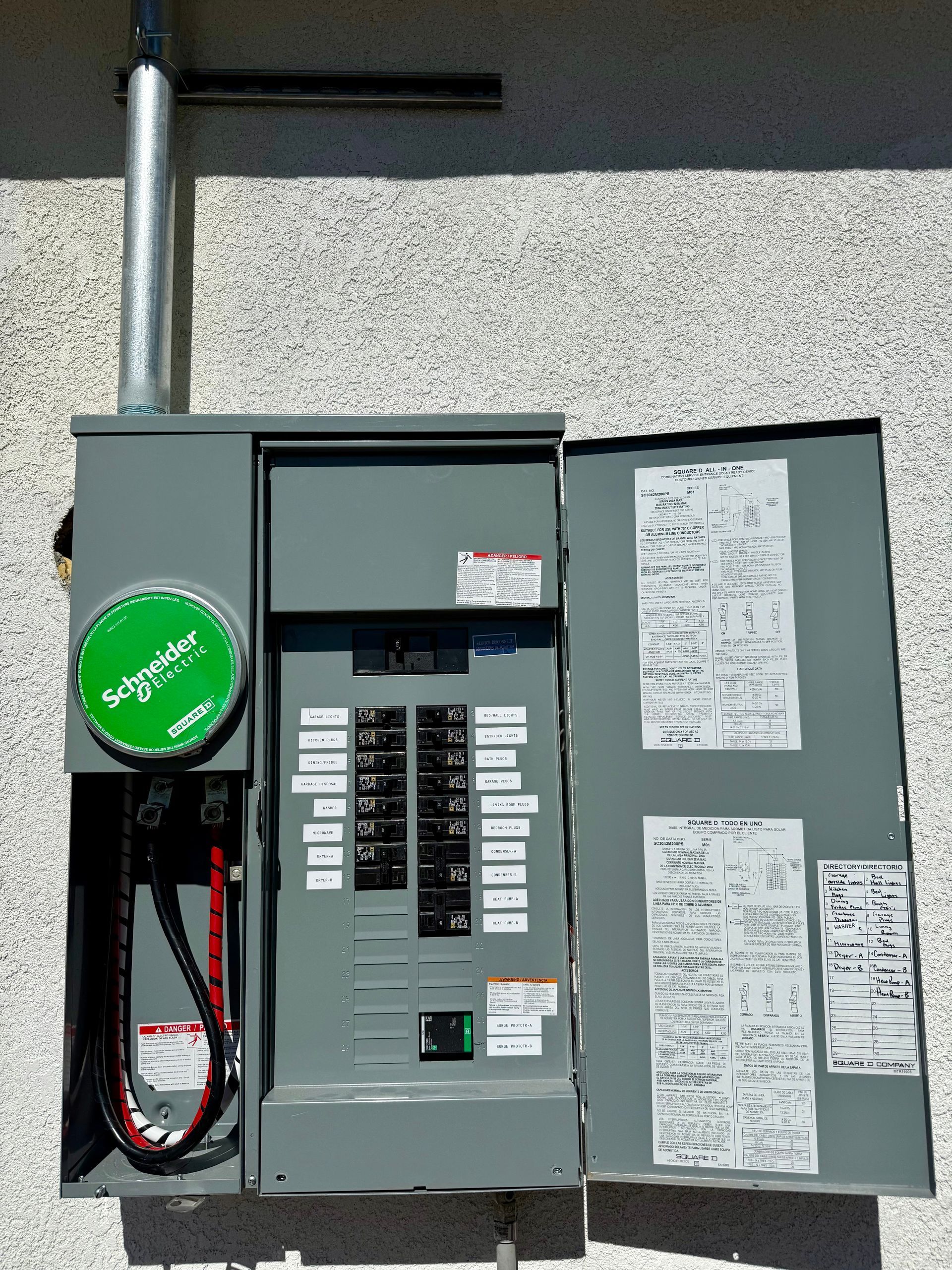 Man using a tool to work on electrical components inside a control panel.