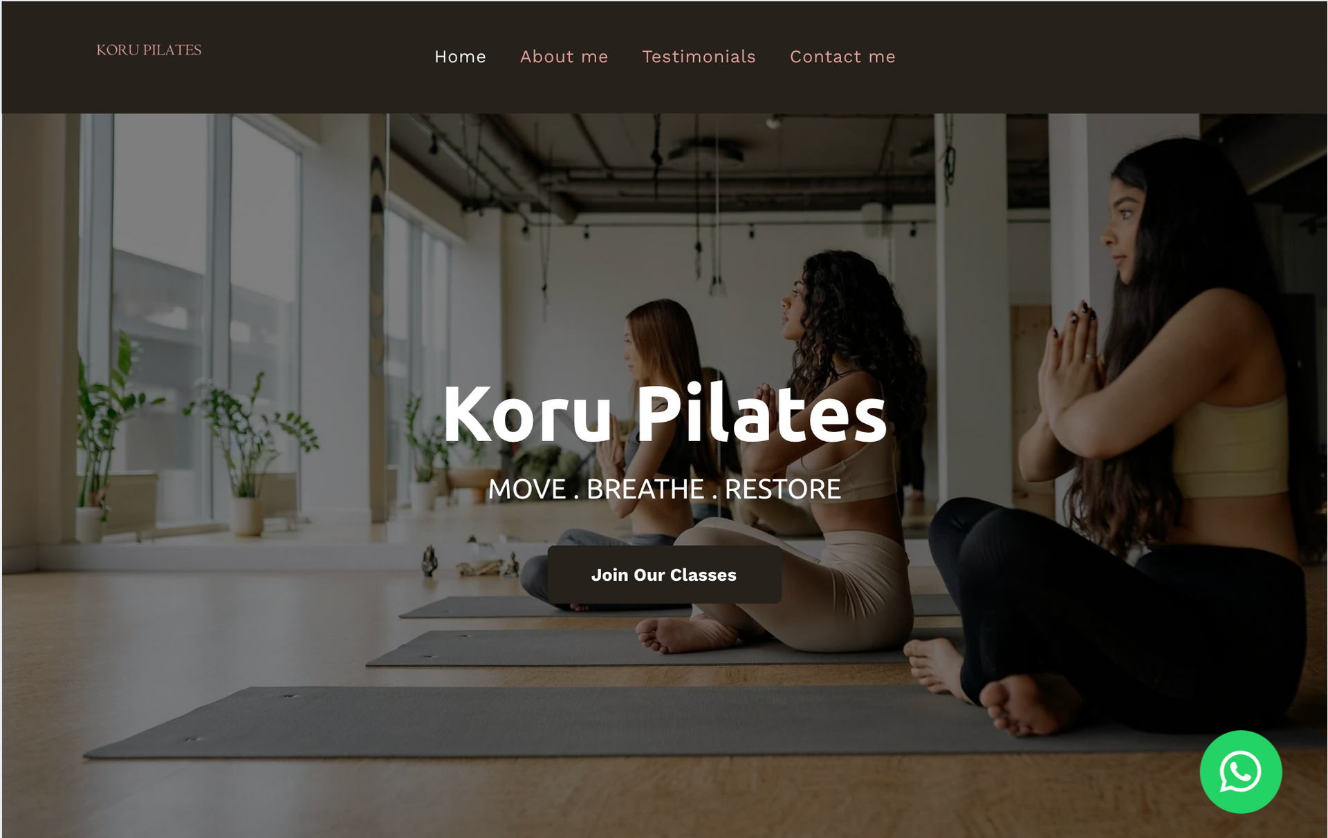A group of women are sitting on yoga mats in a gym.