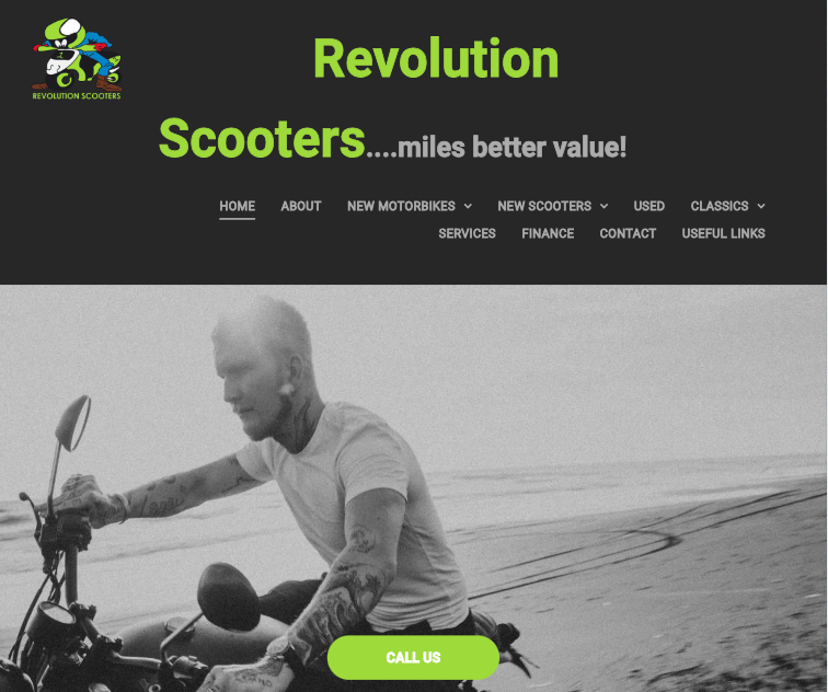 A man is riding a scooter on the beach.