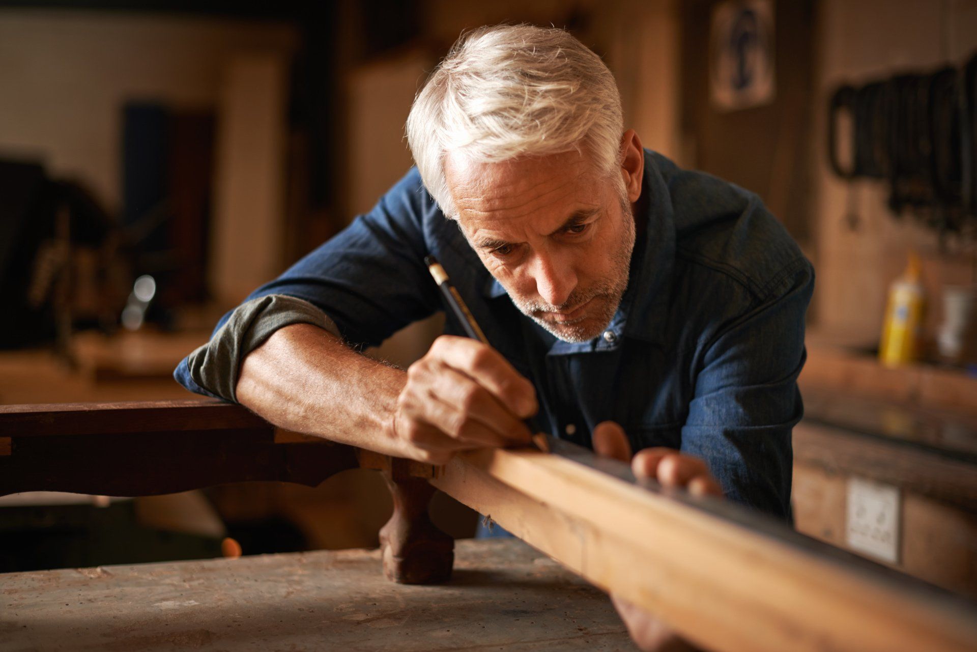 Man measuring a piece of wood