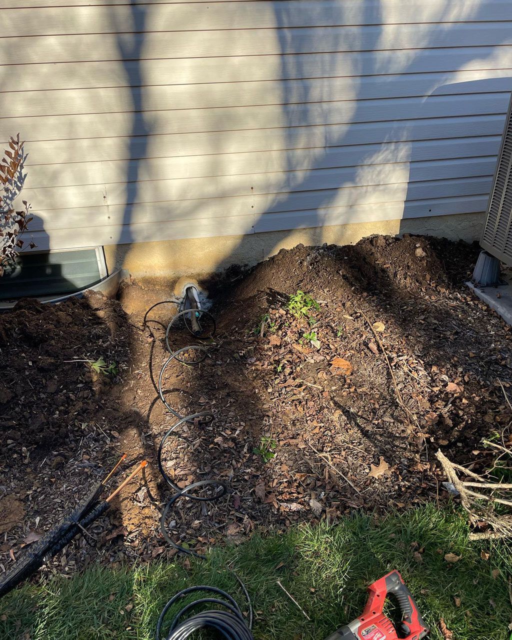 A pile of dirt sitting in front of a house — Bensalem, PA — D.N.A Heating & Air