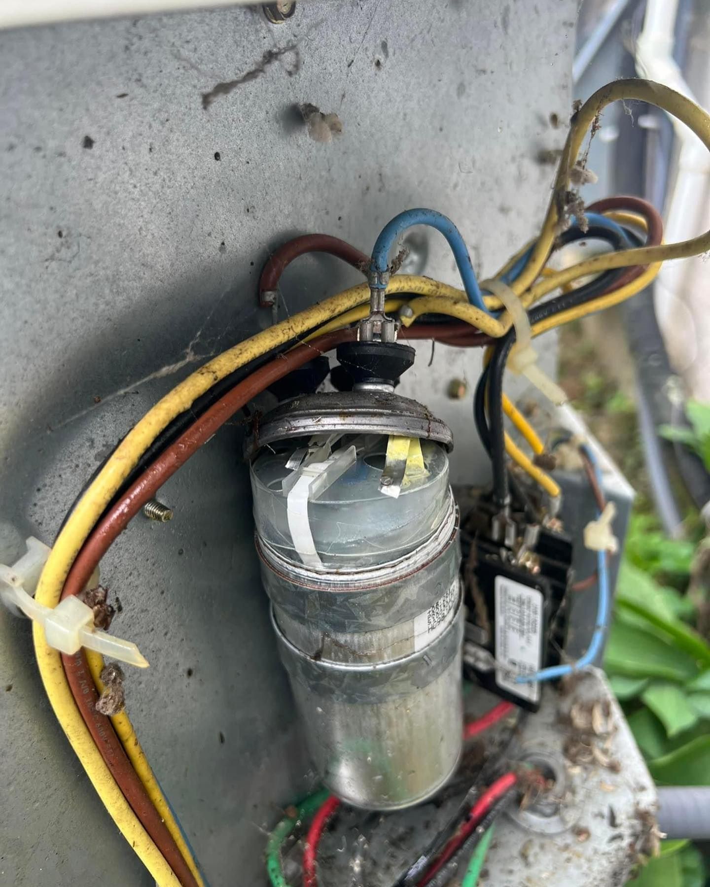 A close up of a capacitor with wires attached to it — Bensalem, PA — D.N.A Heating & Air
