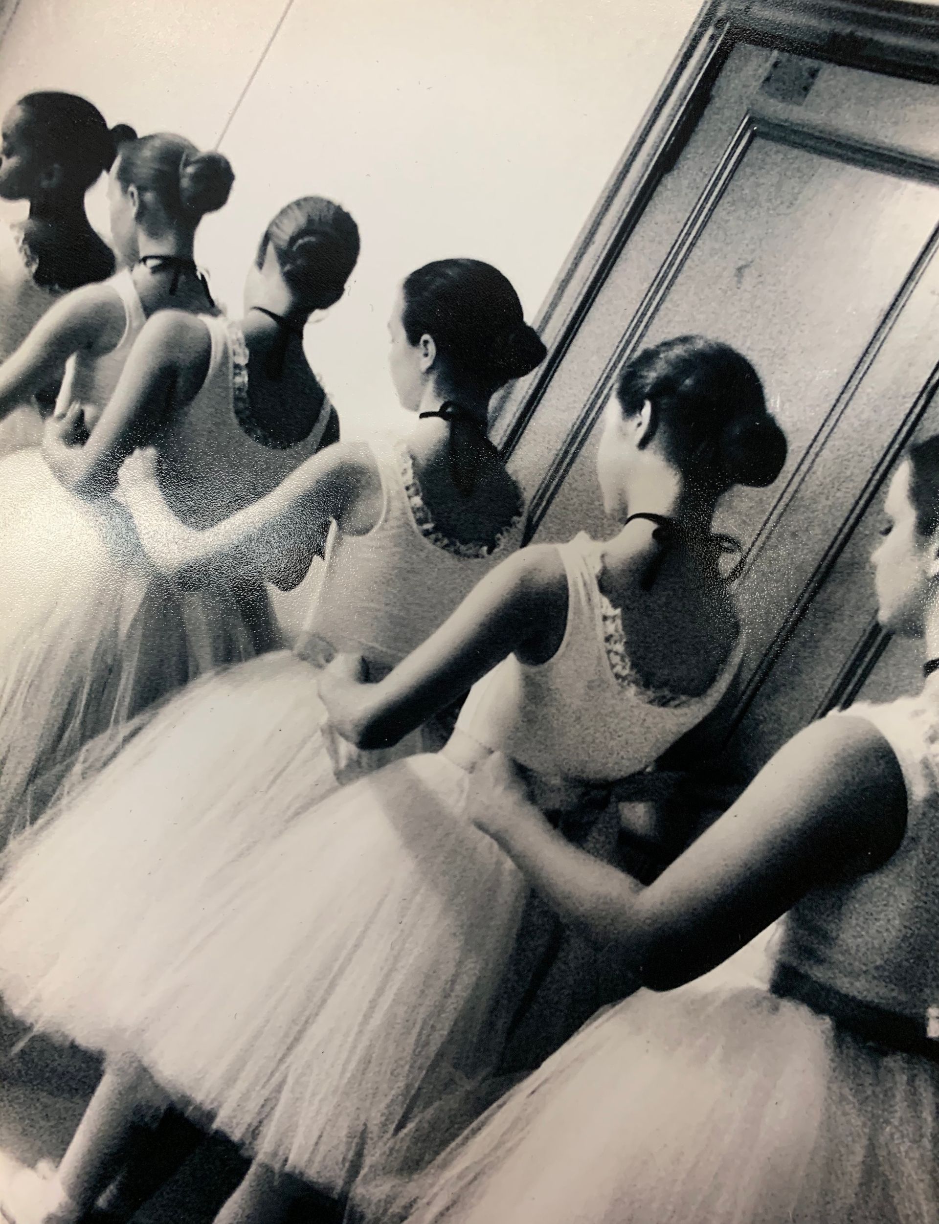 A black and white photo of a group of ballerinas