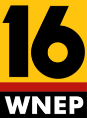 A yellow sign with the number 16 on it