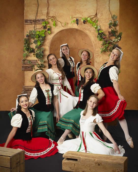 A group of young women are posing for a picture