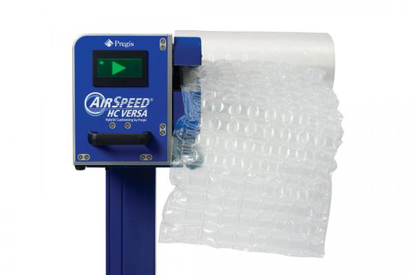 A blue and white machine with bubble wrap on it.