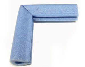 A blue foam corner protector is sitting on a white surface.