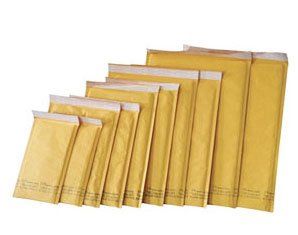 A group of envelopes of different sizes are lined up in a row on a white background.