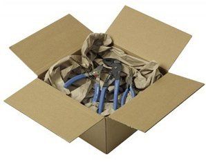 A cardboard box filled with pliers and wrapping paper