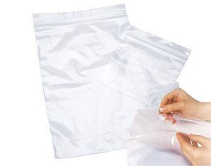 A person is holding a clear plastic bag in their hands.