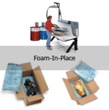 A man is packing a box with foam in place.