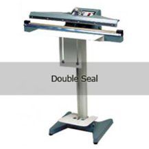 A double seal machine is sitting on top of a table.