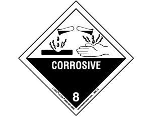 A black and white sign that says corrosive on it