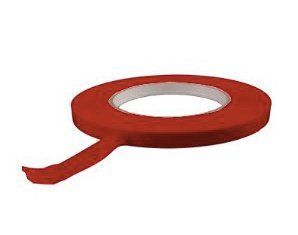 A roll of red tape on a white background.