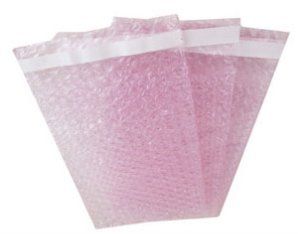 Three pink bubble bags with white tape on a white background