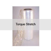 A roll of torque stretch plastic wrap is sitting on a table.