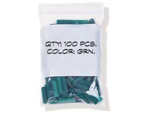 A bag of green plastic pieces with a label that says qty 100 pcs color grn